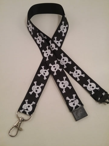 White Skull & crossbones on a black ribbon lanyard made with a safety quick release breakaway id or whistle holder with swivel lobster clasp