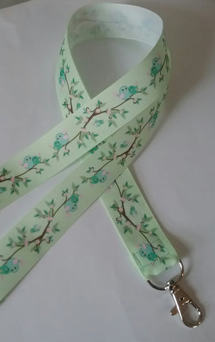 Cute love birds on a green ribbon landyard with safety breakaway lanyard id or whistle holder neck strap