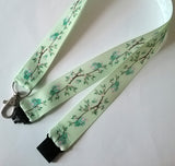 Cute love birds on a green ribbon landyard with safety breakaway lanyard id or whistle holder neck strap - Tilly Bees