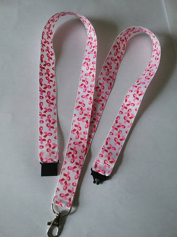 Lanyard made with a pink little piggy ribbon lanyard made with a safety breakaway id or whistle holder with swivel lobster clasp