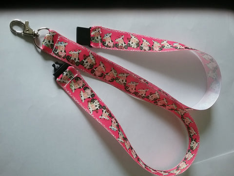 Pink cow patterned ribbon Lanyard it has a safety breakaway fastener with swivel lobster clasp lanyard id or whistle holder