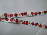 Lanyard made with white ribbon with lots of red ladybirds as the pattern it has a safety breakaway lanyard id or whistle holder - Tilly Bees