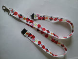 Lanyard made with white ribbon with lots of red ladybirds as the pattern it has a safety breakaway lanyard id or whistle holder - Tilly Bees