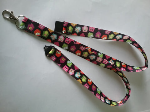 Lots of coloured owls on black ribbon lanyard made with a safety breakaway id or whistle holder with swivel lobster clasp