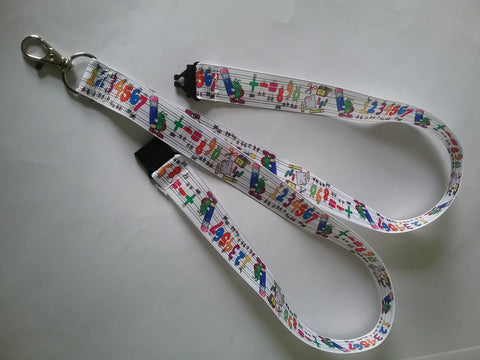 LANYARD white grosgrain ribbon with numbers 123456 as the pattern with safety breakaway clip & silver colored swivel clasp id or whistle butterfly holder