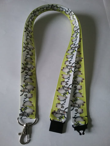 LANYARD Penguins on white & green grosgrain ribbon with safety breakaway clip & silver colored swivel clasp id or whistle holder