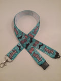 Turquoise blue cartoon dachshund patterned ribbon lanyard made with a safety breakaway id or whistle holder with swivel lobster clasp - Tilly Bees
