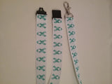 Cervical cancer jade ribbons on a white ribbon lanyard made with a safety quick release breakaway id or whistle holder with swivel lobster clasp - Tilly Bees