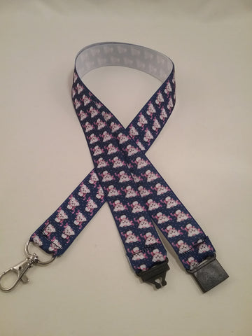 Cute puppy dog on blue ribbon lanyard made with a safety quick release breakaway id or whistle holder with swivel lobster clasp