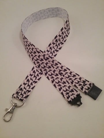 Dog silhouettes natural coloured ribbon lanyard made with a safety quick release breakaway id or whistle holder with swivel lobster clasp
