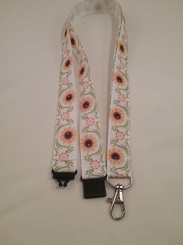 Sunflowers yellow on white ribbon lanyard made with a safety quick release breakaway id or whistle holder with swivel lobster clasp