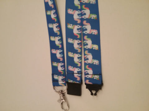 Unicorn on dark blue ribbon lanyard made with a safety quick release breakaway id or whistle holder with swivel lobster clasp
