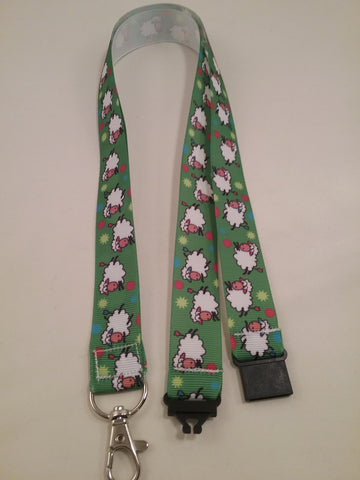 Jumping sheep on green ribbon lanyard made with a safety quick release breakaway id or whistle holder with swivel lobster clasp
