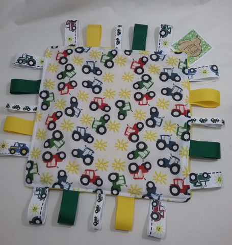 Handmade Childs taggie comfort snuggle blanket tractor themed fabric and yellow fleece plus lots of coloured grosgrain inc tractor ribbons
