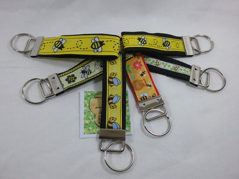 Choice of over 12 different Bee Pattern Fobs for use as keyring, zip pull, bag tags etc. Identity your bags easily or find your keys in your handbag.