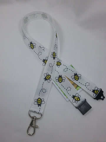 White Honey bee or Bumble Bee ribbon Lanyard it has a safety breakaway fastener with swivel lobster clasp lanyard id or whistle holder